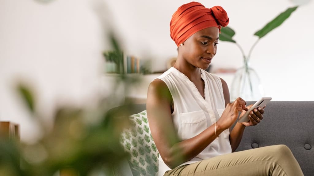 Woman Using Phone at Home